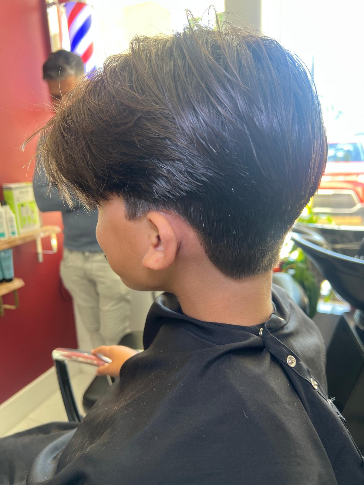 Young boy with a fresh modern kids haircut
