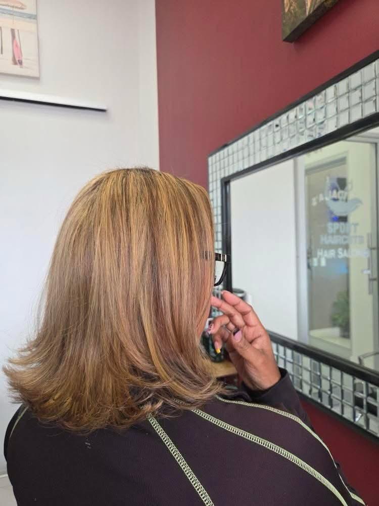 Woman with styled light brown shoulder-length hair